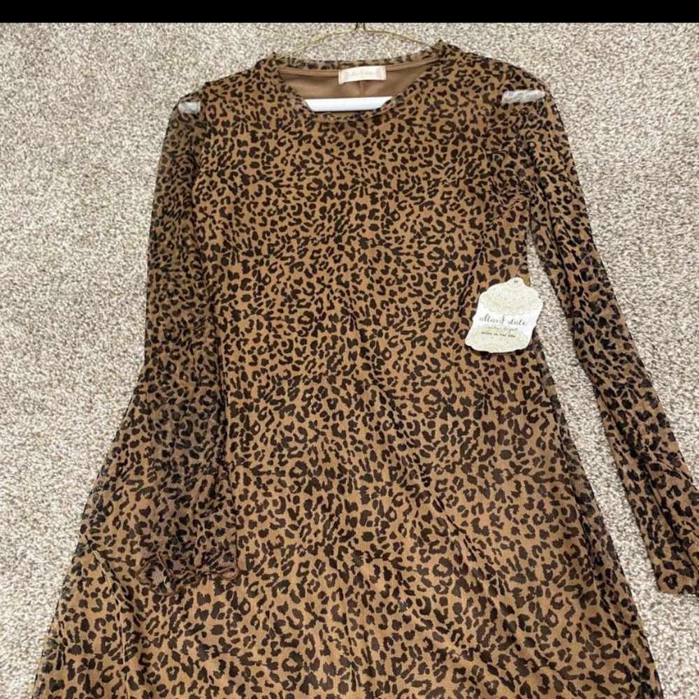 Altered state dress new with tags sleeves sheer the dress itself is not!